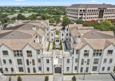 An aerial view of the facade of luxury condos at the Corvalla