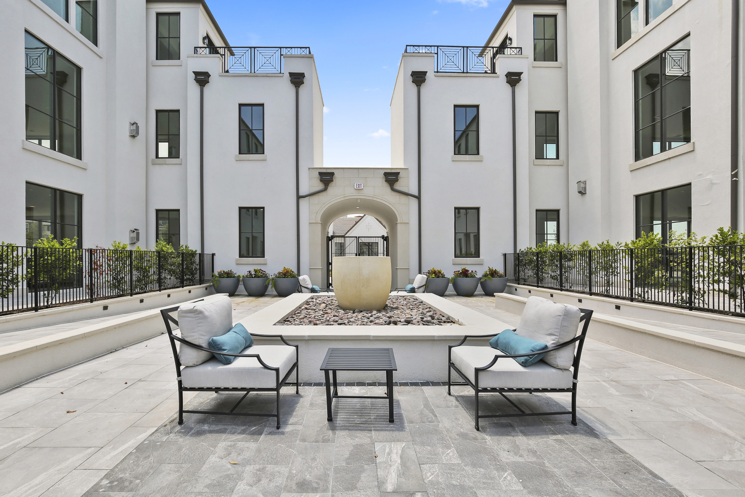 A wide shot of the luxury outdoor entertainment area at the Corvalla condos