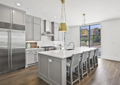 High-end kitchen island and cabinets featyured in condos at the Corvalla
